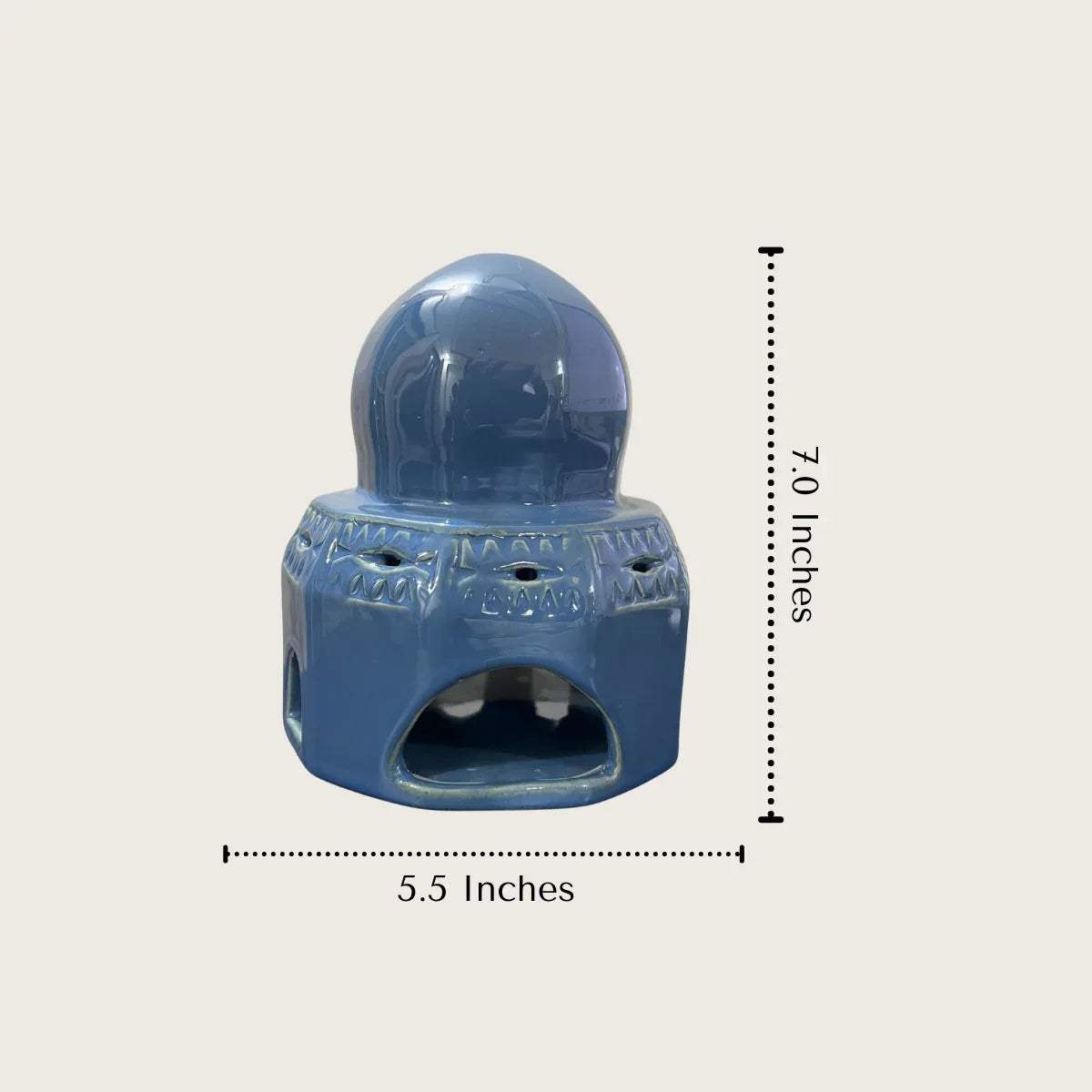 7.0 inches tall blue ceramic tealight candle holder; compact dimensions for stable candle placement and shelf styling.