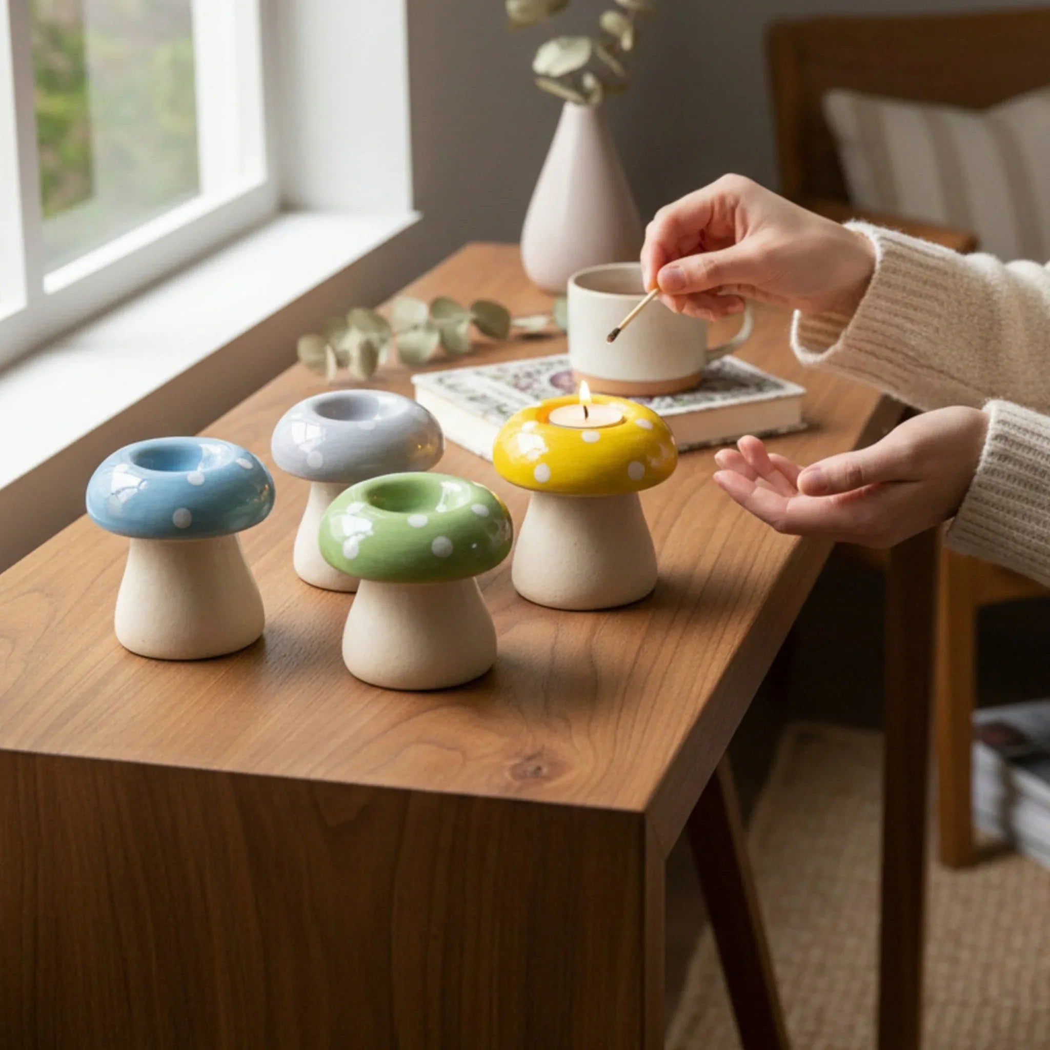 Twilight Toadstool Candle Stand Set; four whimsical, mushroom-shaped ceramic holders in bright tones.