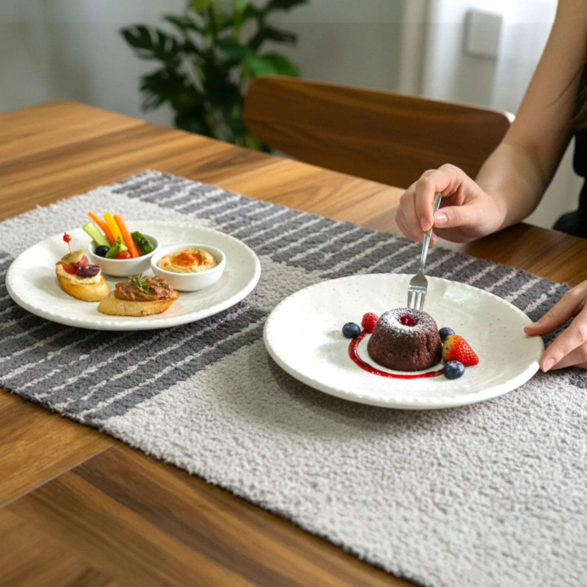 Small bite serving; showing the 7-inch plates holding a single artisanal pastry and a side of fresh berries.