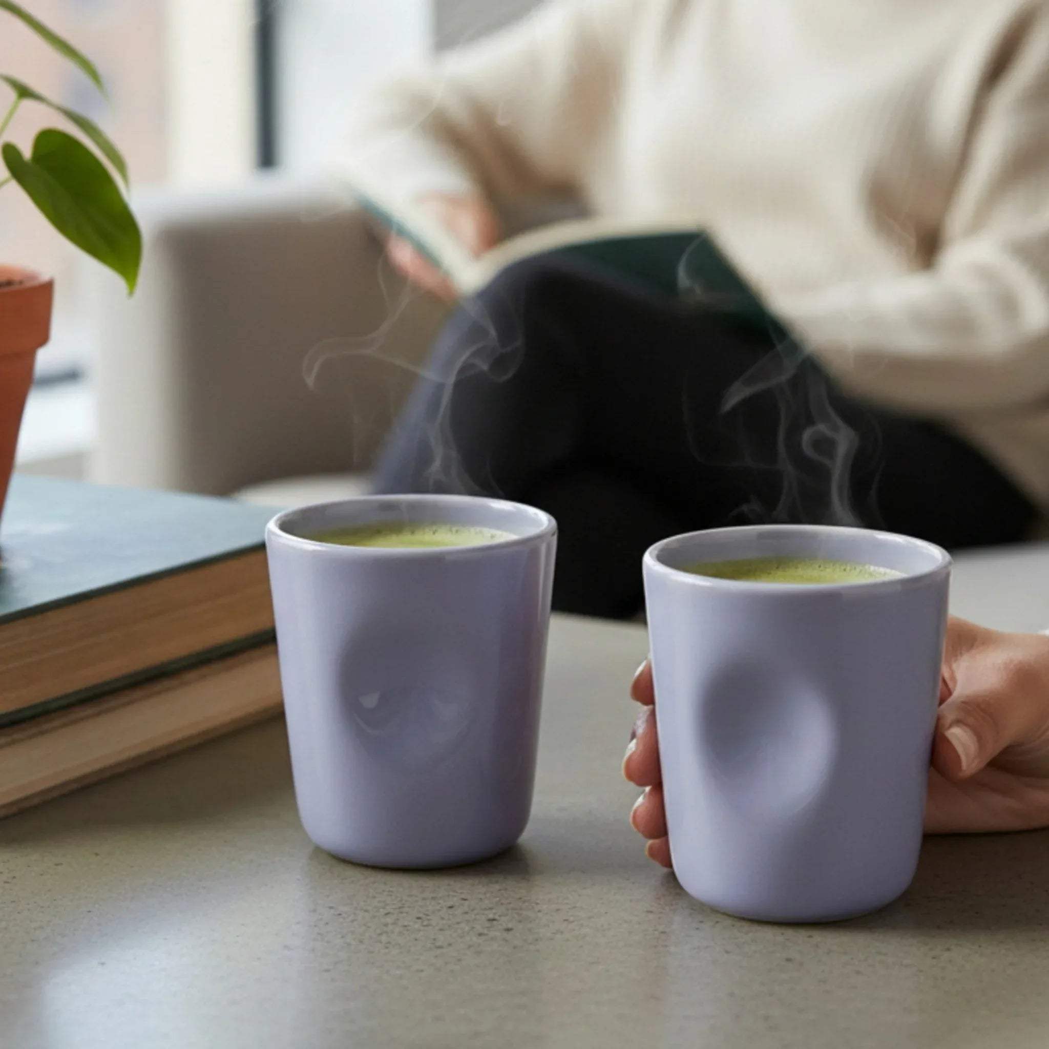 Violet Whisper Glasses; set of 2 glossy lavender ceramic tumblers with a minimalist, stackable design.