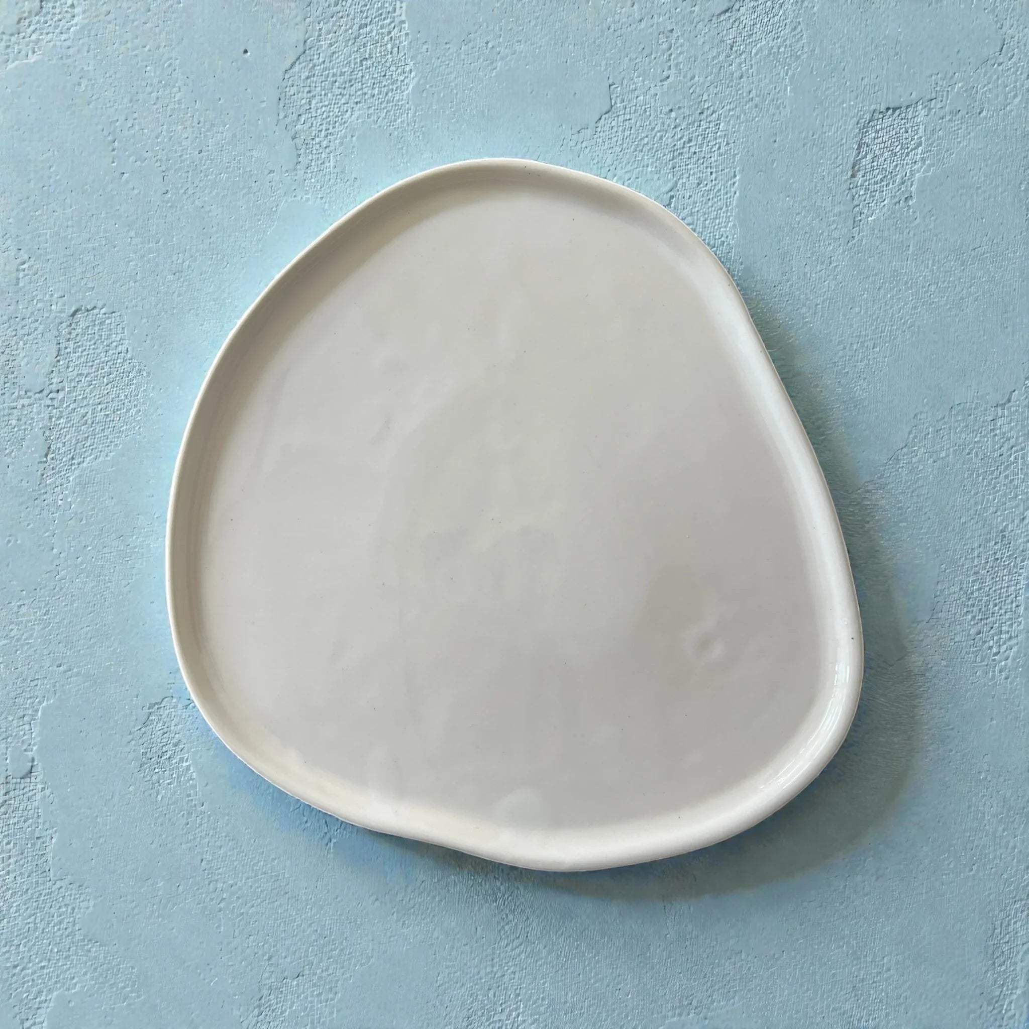 Satin-gloss glaze; a close-up highlighting the subtle cracks, wobbles, and handcrafted texture of the rim.